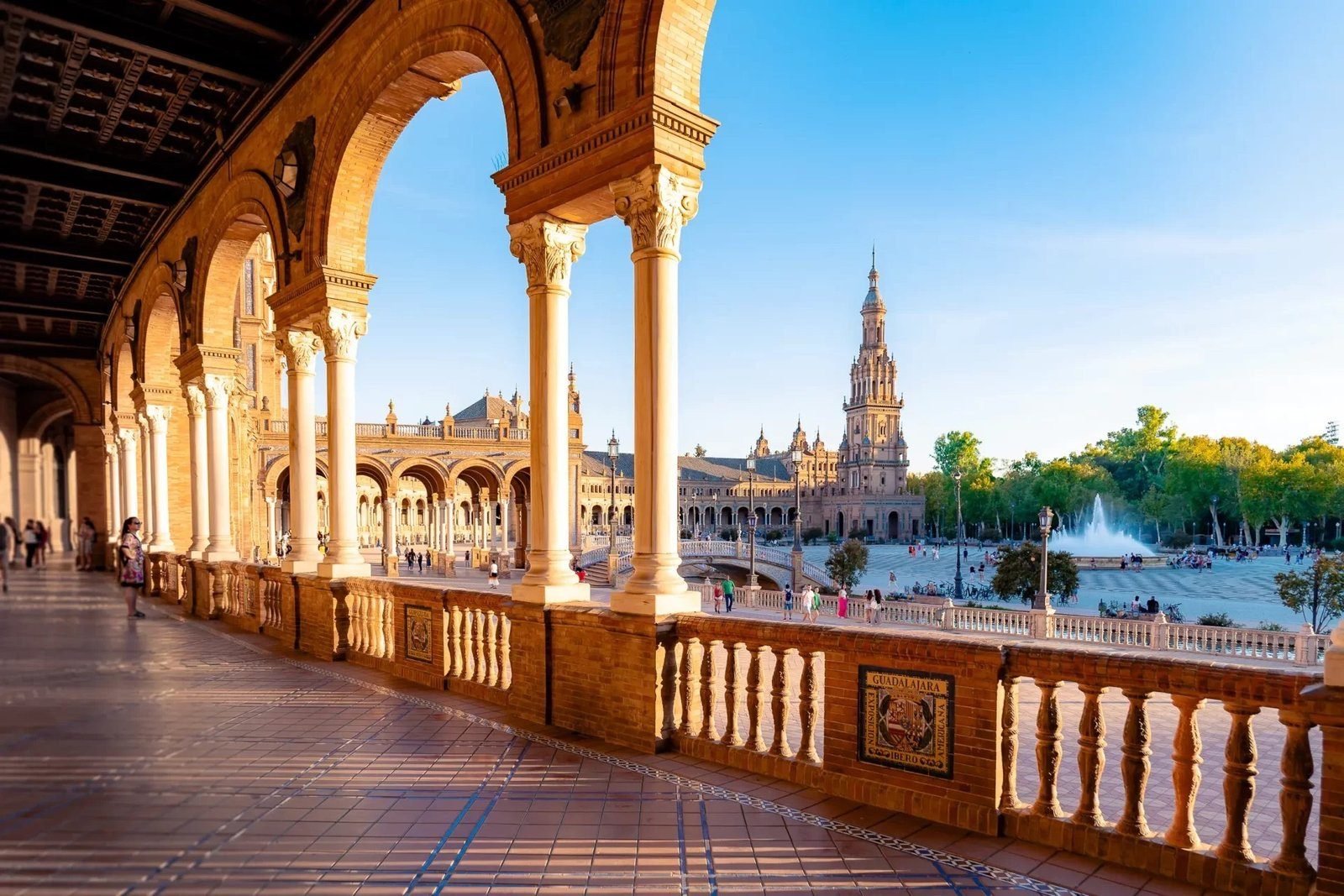 The arcaded gallery of the Plaza de España, Seville, at golden hour